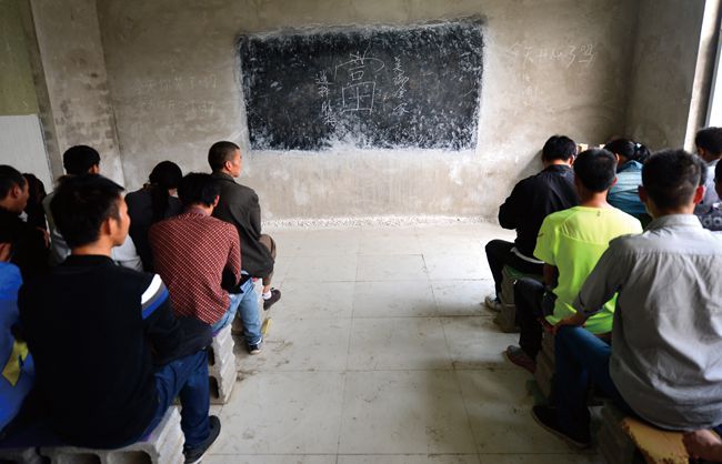 Chinese men meeting up for a chuanxiao meeting, or pyramid scheme meeting in Beijing.
