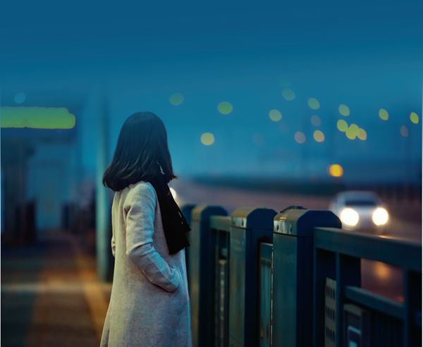 Young graduate pondering her future city life in China.
